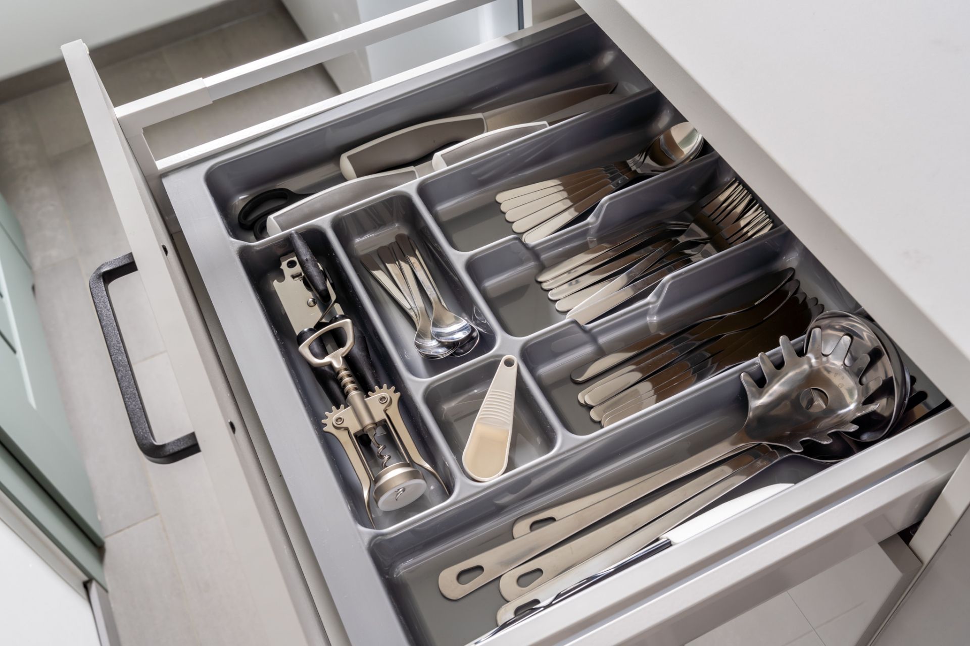 fully equipped kitchen ideal for longer stays in Riga, featuring cookware, kettle and coffee machine