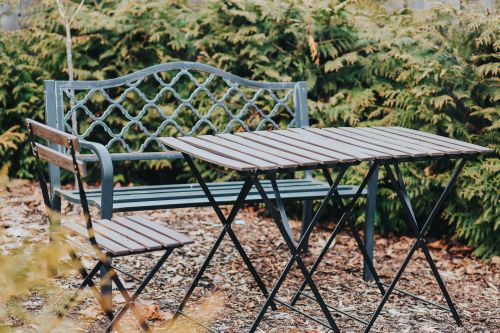 Cozy garden seating area at Garden Apartments Riga, perfect for relaxing outdoors